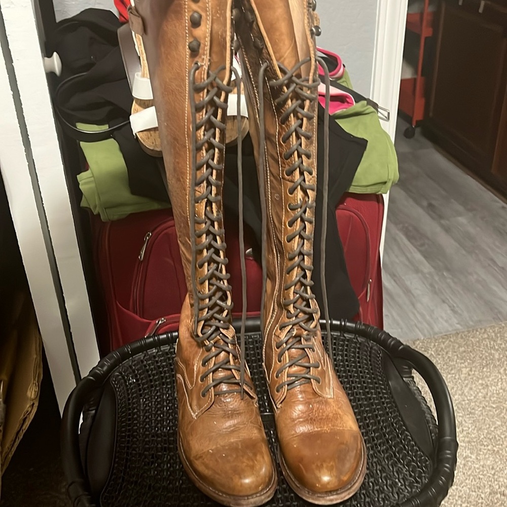 Cognac colored leather knee boots. Laced up.